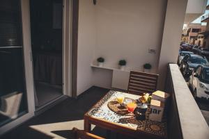 a table with food and drinks on top of a balcony at Terradamare in Monopoli