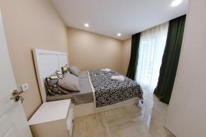 מיטה או מיטות בחדר ב-VIP Sweet Home in Shekvetili