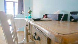 a kitchen with a wooden counter top with a box on it at Nautilus Dome in Fira