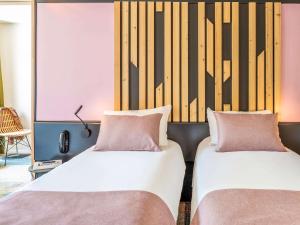 Giường trong phòng chung tại ibis Styles Boulogne sur Mer Centre Cathédrale