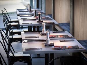 a row of tables with chess pieces on them at The Loft Hotel Adults Only in Kraków