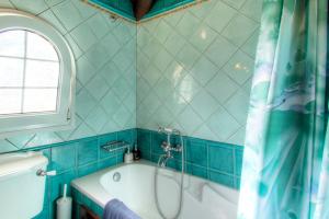 A bathroom at The Red Bougainvillea Apartments