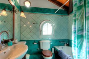 A bathroom at The Red Bougainvillea Apartments