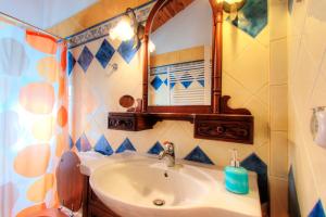 A bathroom at The Red Bougainvillea Apartments