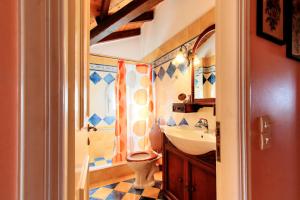 A bathroom at The Red Bougainvillea Apartments