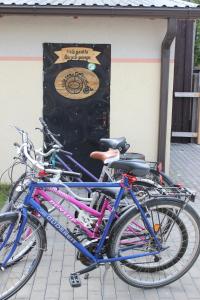 a group of bikes parked next to a building at Windrose in Liepāja