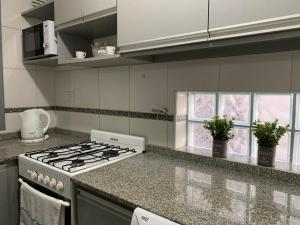 Nhà bếp/bếp nhỏ tại Departamento Nueva Cordoba pa 4personas