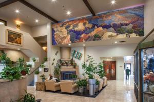 a lobby with a large mural on the wall at Grand Canyon Plaza Hotel in Tusayan