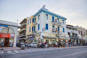 a group of buildings on the side of a street at Amalia City Rooms in Chios