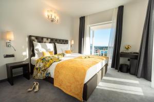 A bed or beds in a room at Villa Bellevue Portoroz-Portorose