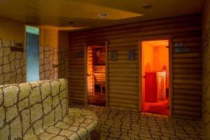 an empty room with a red door in a house at Mirotel Resort and Spa in Truskavets