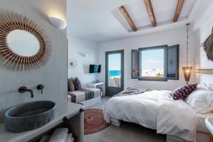 A bed or beds in a room at Bohemian Luxury Boutique Hotel, Adults Only