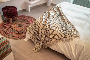 A bed or beds in a room at Bohemian Luxury Boutique Hotel, Adults Only