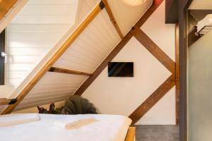 a bedroom in the attic of a house at Bunk Hotel Utrecht in Utrecht