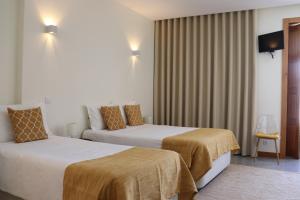 Cama ou camas em um quarto em Enjoy Viana - Guest House