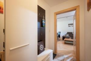 a hallway with a door leading to a living room at Appartement Unterbering in Söll