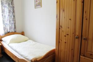 Cama ou camas em um quarto em Pension Locarno