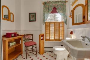 a bathroom with a white toilet and a sink at Our Space the Perfect Place B&B in Picton