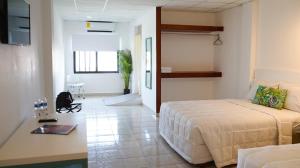 Voodi või voodid majutusasutuse Hotel & Suites Arges - Centro Chetumal toas