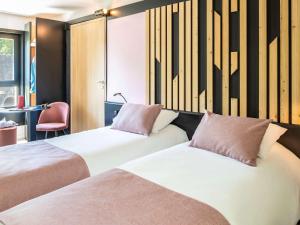 Giường trong phòng chung tại ibis Styles Boulogne sur Mer Centre Cathédrale