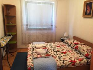 Cama ou camas em um quarto em Niš Apartman