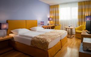 מיטה או מיטות בחדר ב-Appartement-Hotel an der Riemergasse