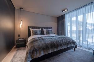 Cama ou camas em um quarto em Hotel Zhero – Ischgl/Kappl