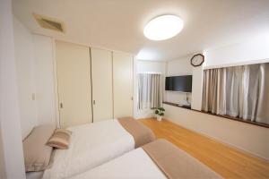 SHINJUKU 5-ROOM Family house में टेलीविजन और/या मनोरंजन केंद्र