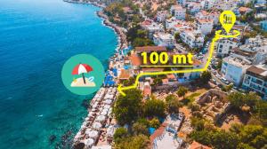 - une vue aérienne sur une plage avec un parasol et l'océan dans l'établissement Hotel Sonne - Adults Only, à Kaş