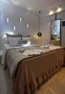 Voodi või voodid majutusasutuse Quartano Luxury Cycladic Residence, Adults Only (13+) toas