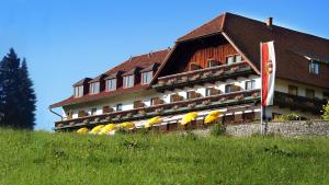 a building with a bunch of umbrellas in front of it at Hotel Schöne Aussicht in Salzburg