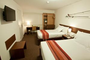 A bed or beds in a room at Tierra Viva Miraflores Larco