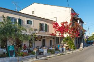 a building on the side of a street at Takis Family Corfu in Kontokali