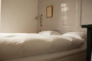 Katil atau katil-katil dalam bilik di Boutique-Hotel Guesthouse Le Locle