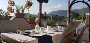 a table with a blue table cloth on a patio at Il fiore di loto in San Felice Circeo