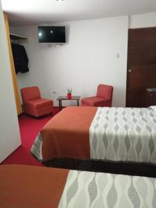 Ліжко або ліжка в номері Pandora hotel colca