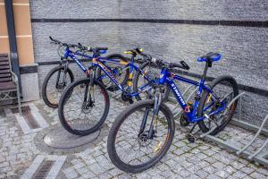 two bikes parked next to each other on a street at Green Park Hotel & SPA in Truskavets