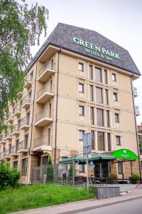 a large building with a green tent in front of it at Green Park Hotel & SPA in Truskavets