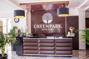 a hotel lobby with a sign that reads green park hotel akhtar at Green Park Hotel & SPA in Truskavets