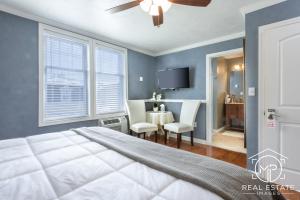 a bedroom with a bed and a dining room with a table at Bouchard Restaurant & Inn in Newport