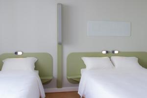 Ibis Budget Braga Centro 객실 침대