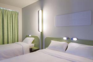 Ibis Budget Braga Centro 객실 침대