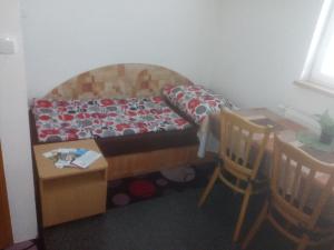 Una cama o camas en una habitación de Penzion Apartmány Zlín