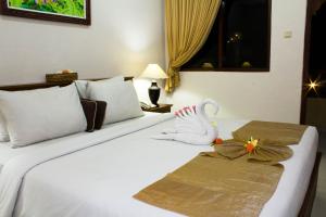 Posteľ alebo postele v izbe v ubytovaní Bali Palms Resort