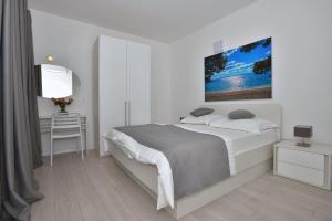 Tempat tidur dalam kamar di Villa Dalmatia Apartments