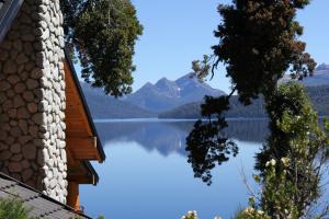 a view of a lake from a house at Cabañas Quetrihue in Villa La Angostura