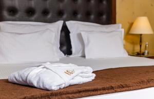 Uma cama ou camas num quarto em Maxi Park Hotel & Spa