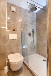 a bathroom with a shower and a toilet at Villa Teuta in Trogir