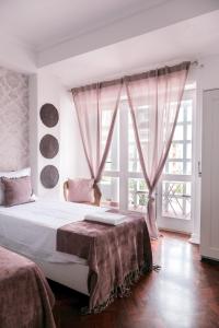 Cama ou camas em um quarto em 4U Lisbon Suites & Guesthouse VII Airport