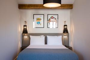 A bed or beds in a room at Urbano FLH Hotels Lisboa